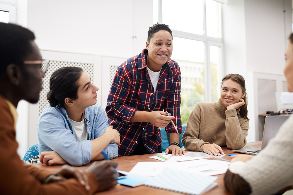 Young people having a meeting in a conference room